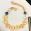 Imitation Chanel Round Metal Cutout Lettering Bracelet Gold/Blue 2019 Collection CE02369